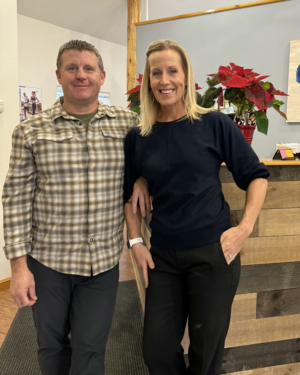 Dr. Jason and Dr. Nichole Casto at the front desk of their South Lake Tahoe office